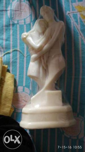 Statue of marble with front portion coated with radium