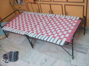 White And Red Woven Camping Bed
