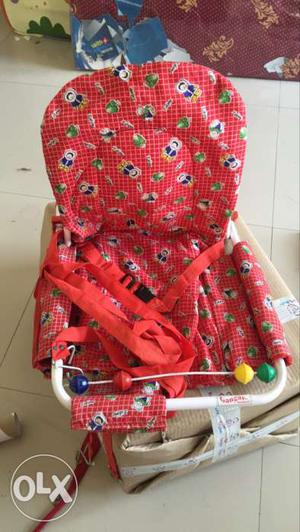 Red colour hanging swing suitable for age grp 1