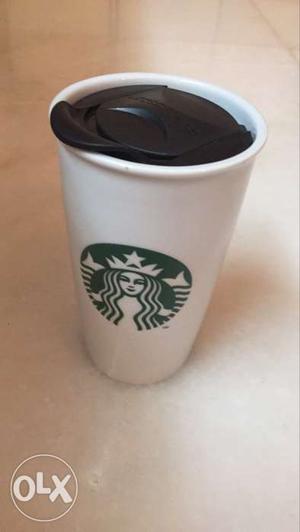 A brand new starbucks creamic mug with sliding