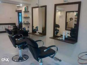Black Leather Barber's Chairs And Rectangular Wall Mirrorrs