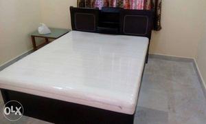 Black Wooden Panel Bed Frame And White Mattress
