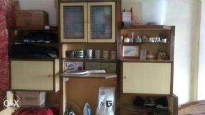 Brown Wooden Cabinet With Mugs And Vases