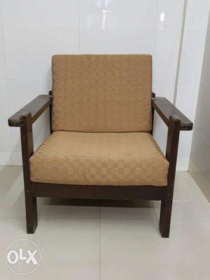 Brown Wooden Frame And Brown Padded Armchair