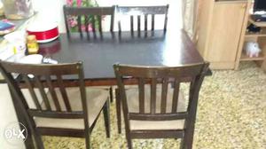 Brown Wooden Rectangular Dining Table And 4 Chairs