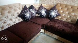 Tuede puffed dark brown sofa with cushions