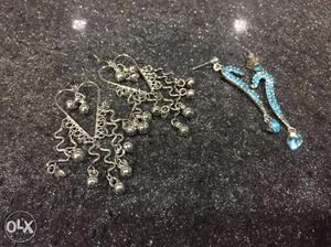 2 pairs of earrings. silver long earrings and