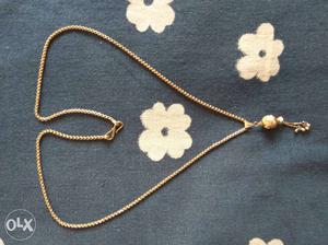 24 ct gold chain with ball pendant. 13 or 15 grms would