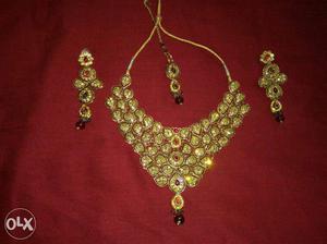 Brand-new condition golden and maroon necklace