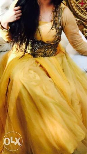 Its a long pretty yellow gown gown price is 