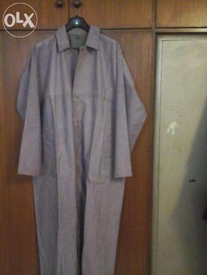 One raincoat of "Duckback" in good condition and blue