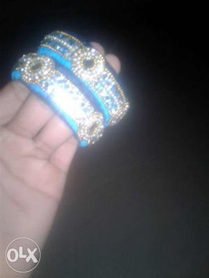 Pair Of Gold, Blue And Diamond Bangles
