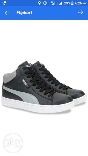 Pair Of Gray And White Puma High Top Sneakers