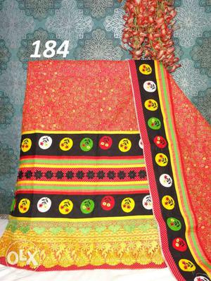 Red, Black, Yellow And Green Textile