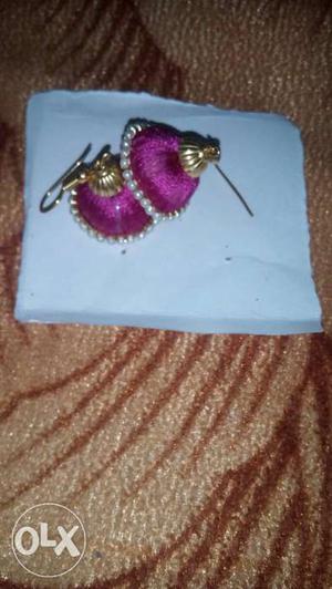 This is a silk threaded earring..pink in colour