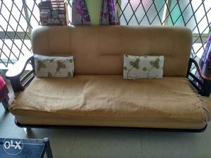 Brown Wooden Futon Sofa / 3 seater has soften and may Need