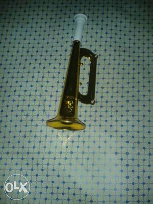Golden Brown And White Plastic Trumpet Toy