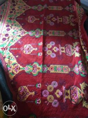 Red Yellow And Green Floral Textile. 1 week old bedsheet