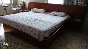 White Pink And Green Floral Bedding Set And Brown Wooden