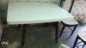 Wooden Dining table with 4 chairs. 1 chair is