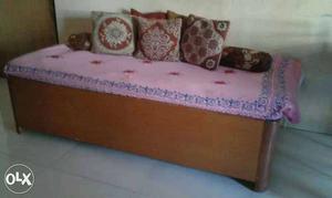 Wooden single bed with storage..