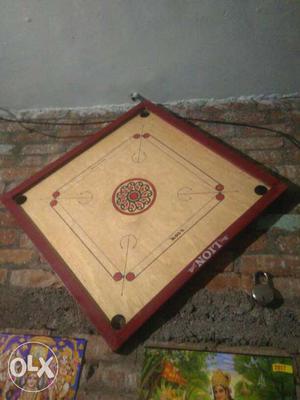 Brown And Red Lion Carrom Board