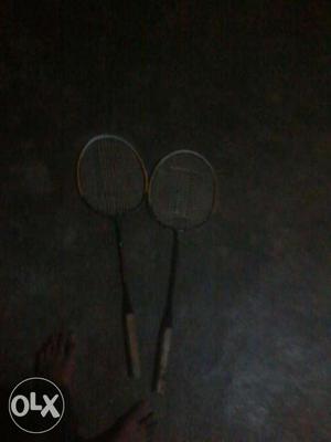Pair Of Brown And Black Badminton Racket