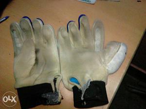 White, And Beige Stained Work Gloves