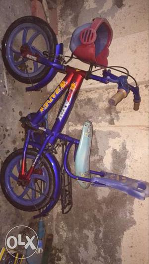 Child's Purple And Red Huffy Bicycle