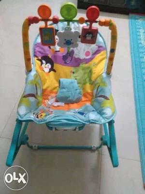 Toyhouse baby bouncer and rocker. has music and