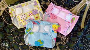 Washable and reusable baby nappies with inserts.