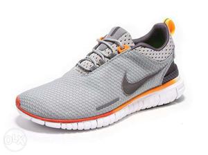 Gray, Orange, And White Nike Running Shoe