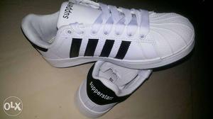 Pair Of Black And White Supperstarr Low Tops