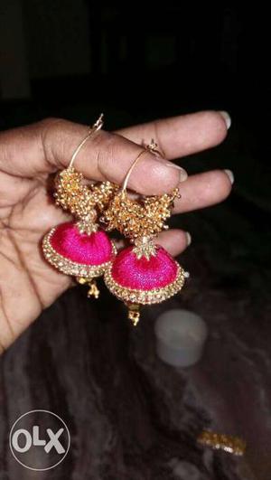 Pair Of Gold And Pink Accessories