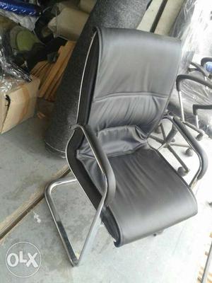 Black Leather Grey Metal Base Padded Armchair