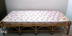 Cane cot with mattress