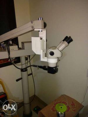 Grey And White Pedestal Microscope