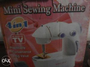 Mini Sewing Machien with Box & pad & electric charge.