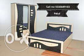 White And Black Wooden Bed Frame With Blue Mattress