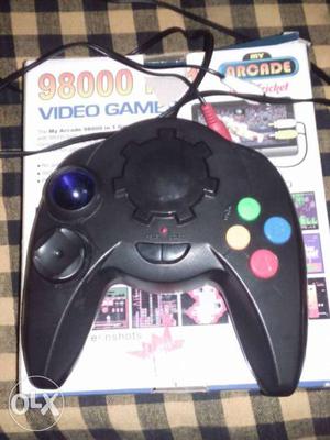 Black  Video Game Controller With Video Games