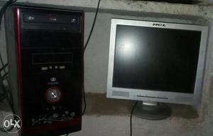 Grey Hcl Flat Screen Monitor With Black And Maroon Computer