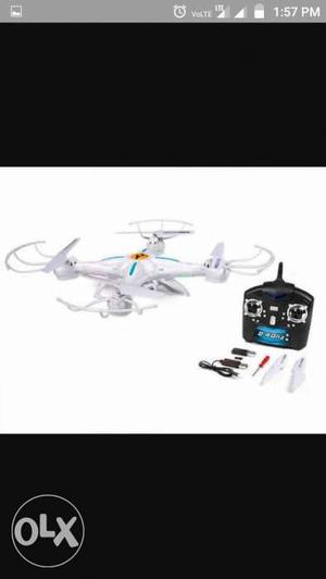 White Quadcopter And Black Controller
