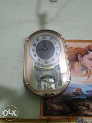 Brow And White Pendulum Clock