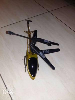 Gold And Black Helicopter Toy