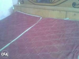 Two Red Quilted Mattresses