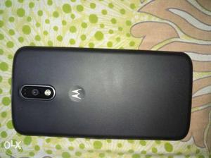 Motorola moto g4 plus with charger and headphones
