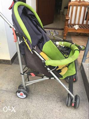 Baby's Green Black And Blue Stroller