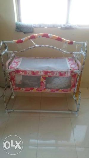 Baby's Pink, White And Brown Floral Cradle
