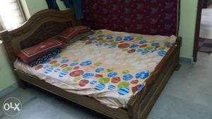 Bed Linen Set And Brown Wooden Bed Frame