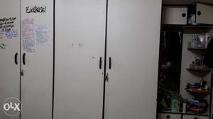Four door bedroom wardrobe with top cabinets